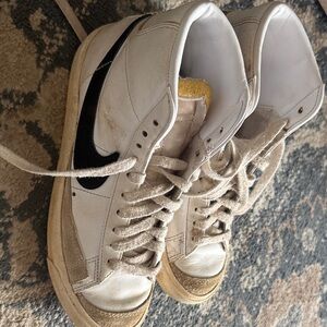 Nike White High-Top Sneakers with Black Swoosh